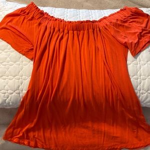 Orange off the shoulder stretch top hem .  Loose style for summer